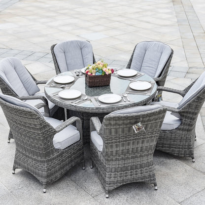 Set da pranzo rotondo da esterno in 7 pezzi in vimini di rattan con cuscini di Moda Furnishings